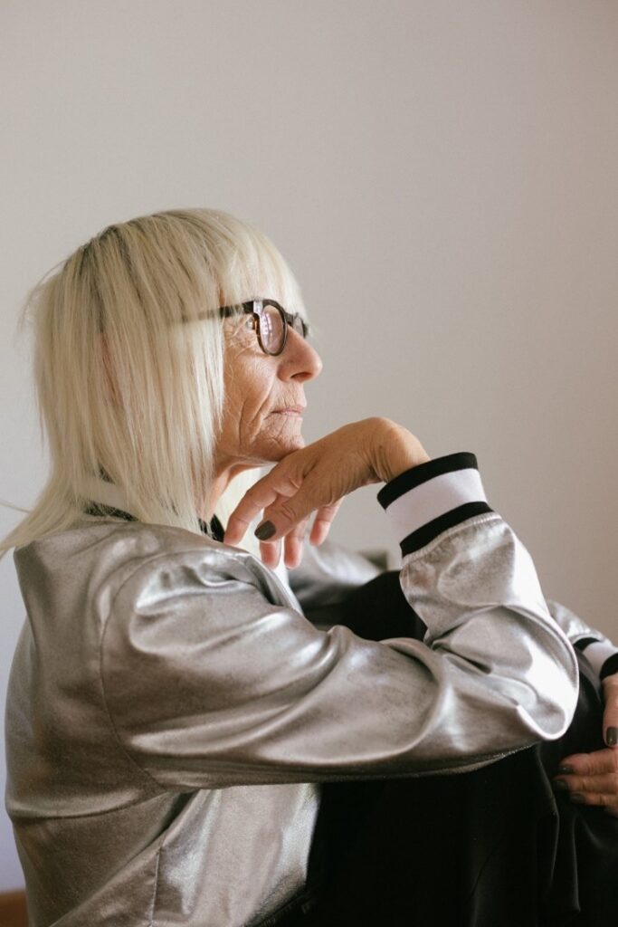 A pensive elderly woman